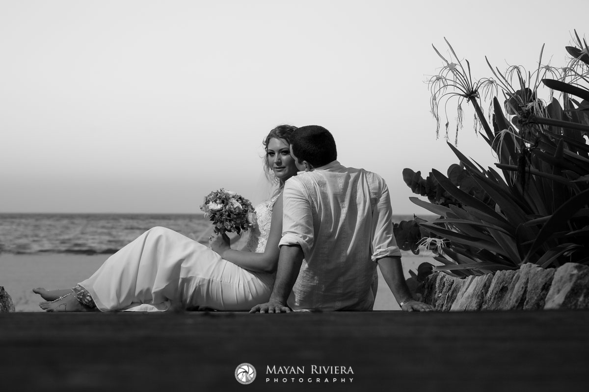 NewlywedsKissOnBeachStairs