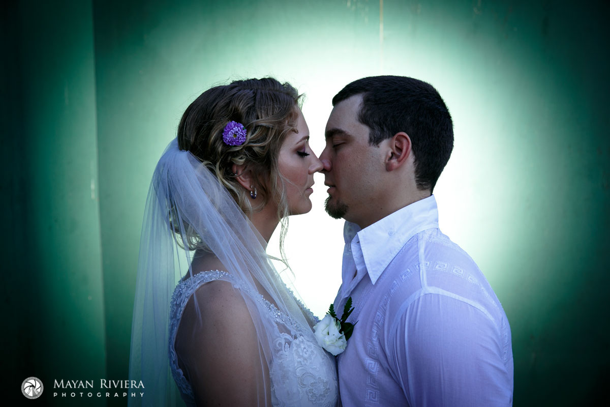 NewlywedsShilouettedByGreenLight