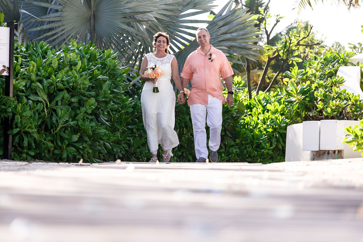 AnniversaryCoupleWalkInOnPetals