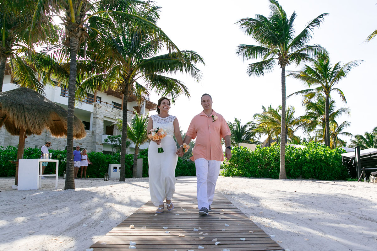 AnniversaryCoupleWalkInOnPetals