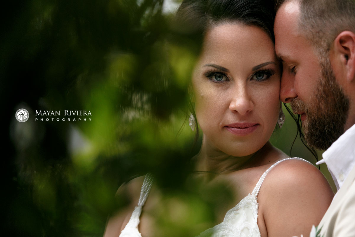Groom nuzzles face of his beautiful bride