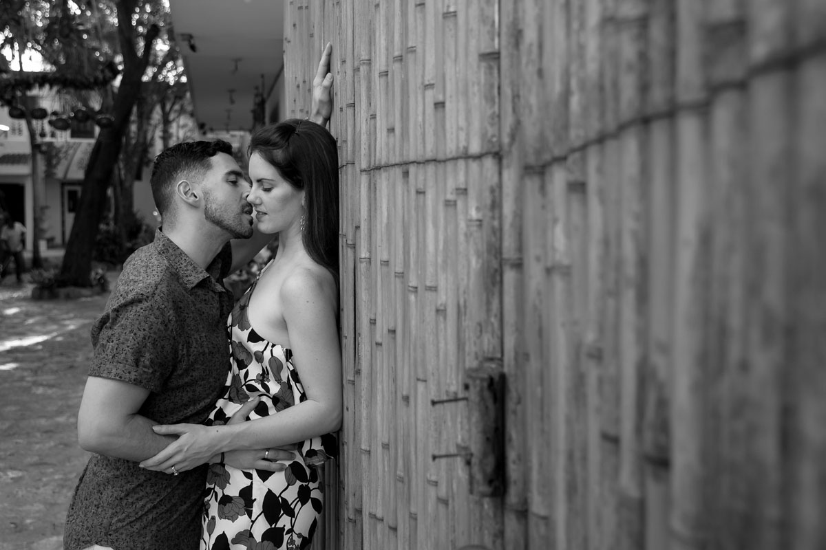HusbandKissesWifeByWall