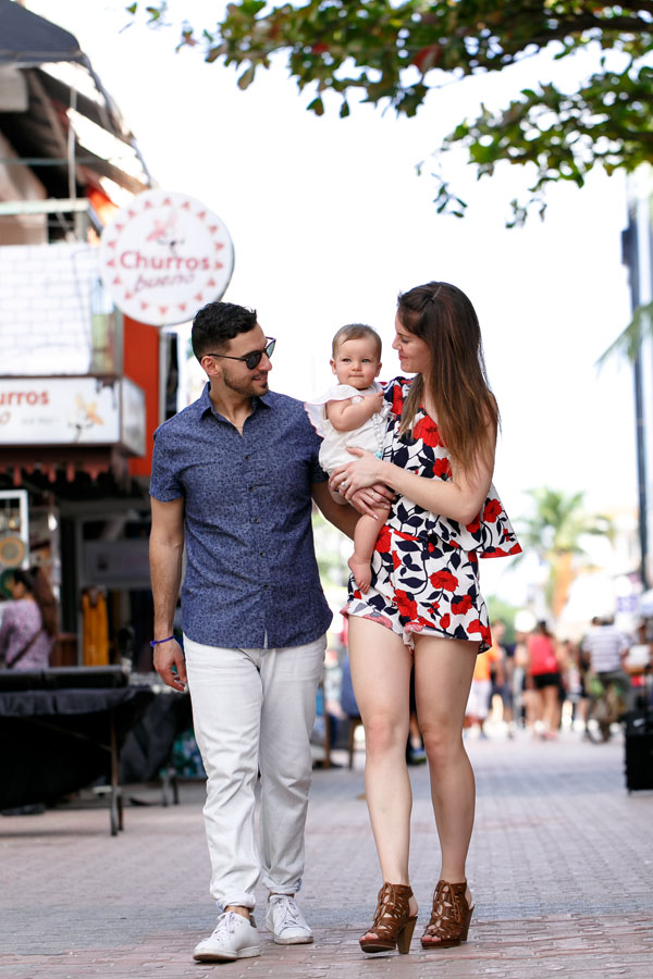 MamaCarriesBabyOnStreetwalk