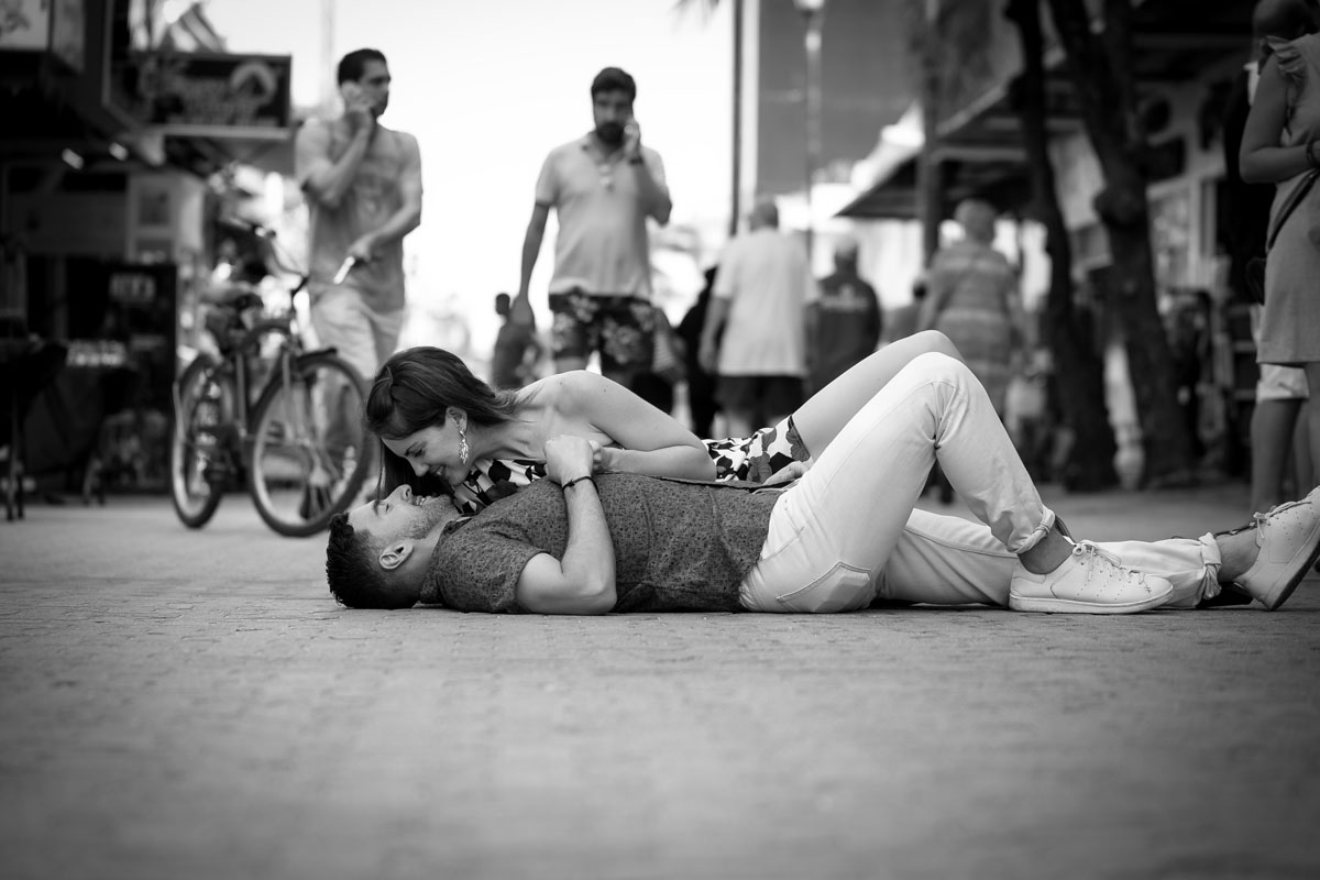 CoupleReclineOnBusyStreet