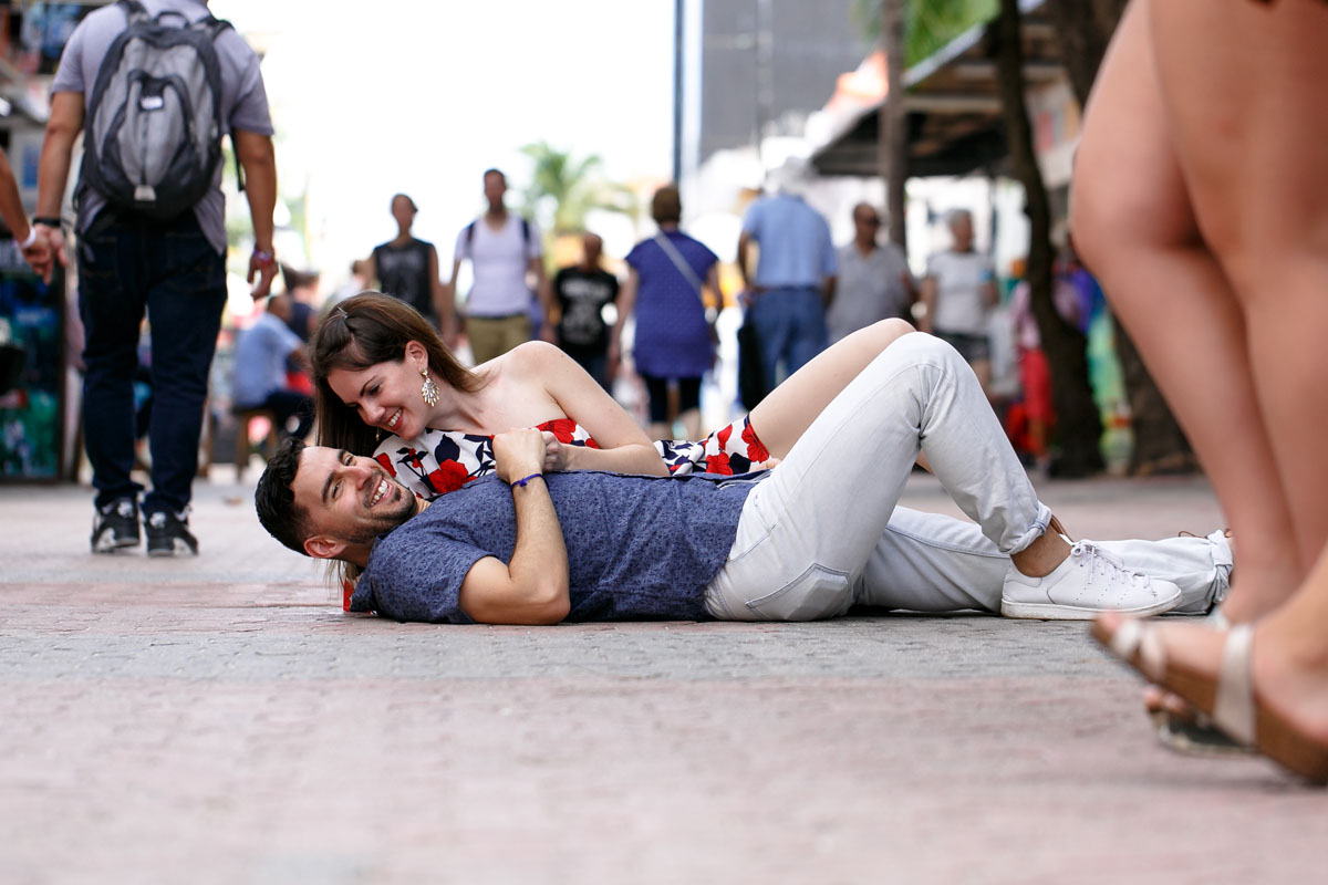 CoupleReclineOnBusyStreet