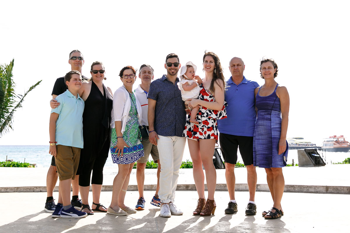 ExtendedFamilyPosesOnBeachSidewalk