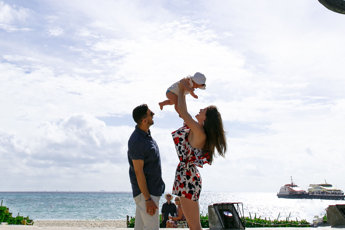 ParentsTossLaughingBabyInAir