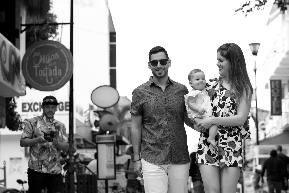 ProudParentsStrollStreetWithSmilingBaby