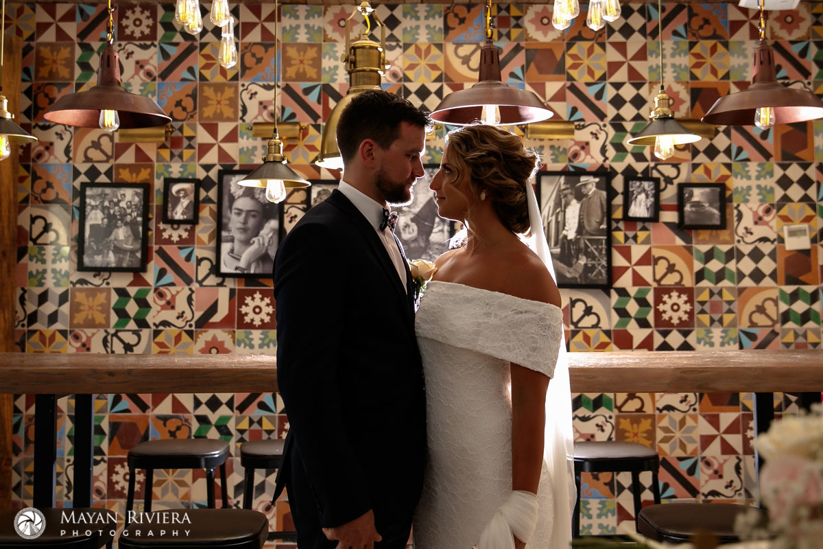 WeddingCouplePosesInColorfulBar
