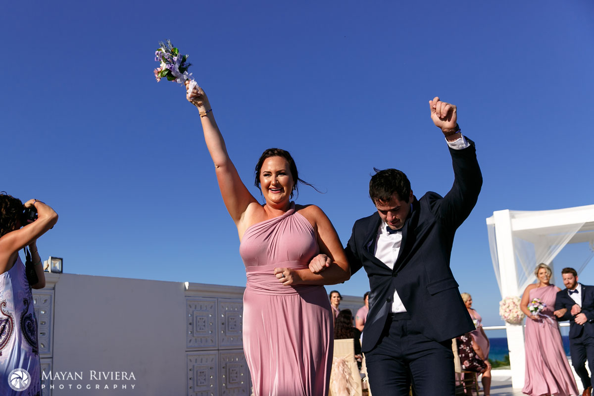 BridalPartyCheeringNewlyweds