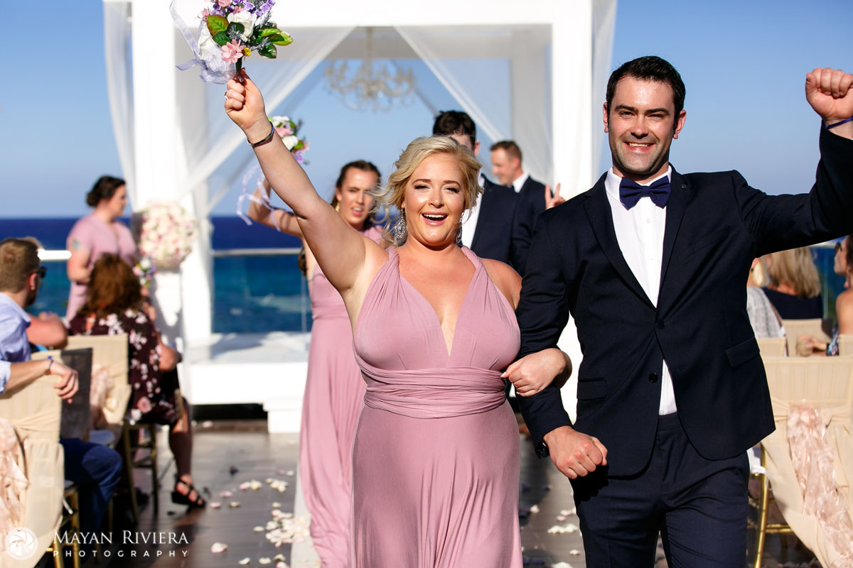 BridalPartyCheeringNewlyweds
