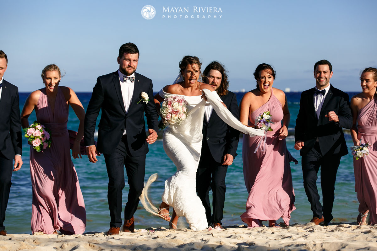 WeddingPartyRunsOnBeach