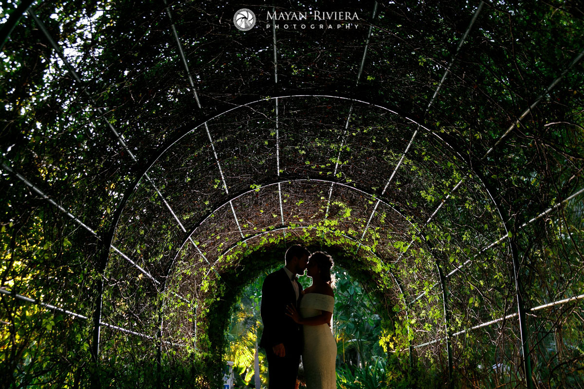 NewlywedsNuzzleInVineTunnel