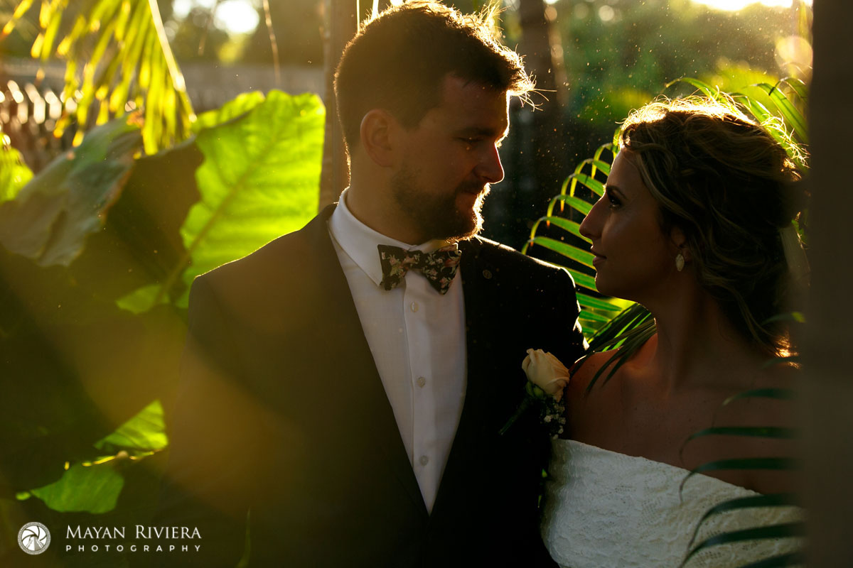NewlywedsGazeAtEachOtherInGoldenSunsetLight