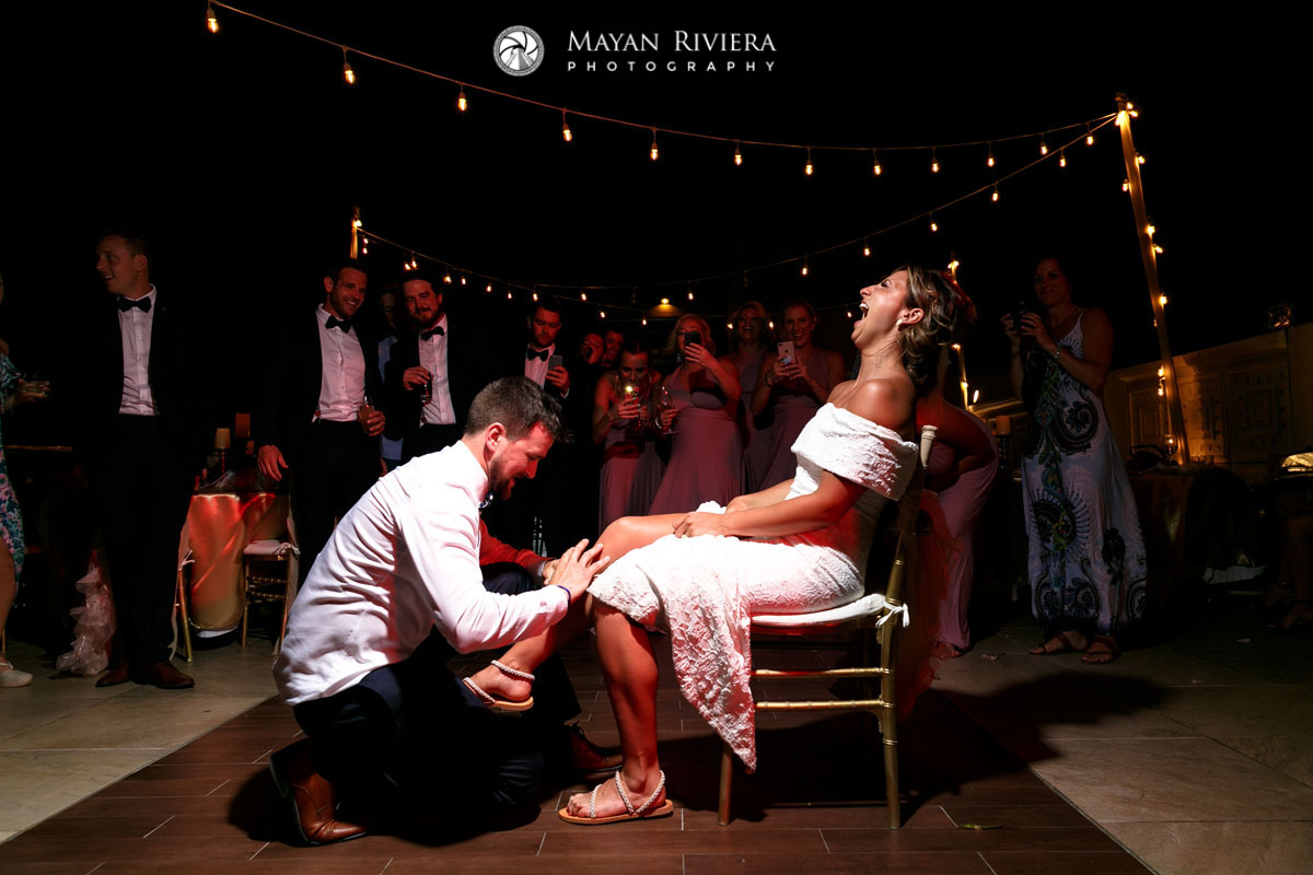 GroomRemovesBridesGarter