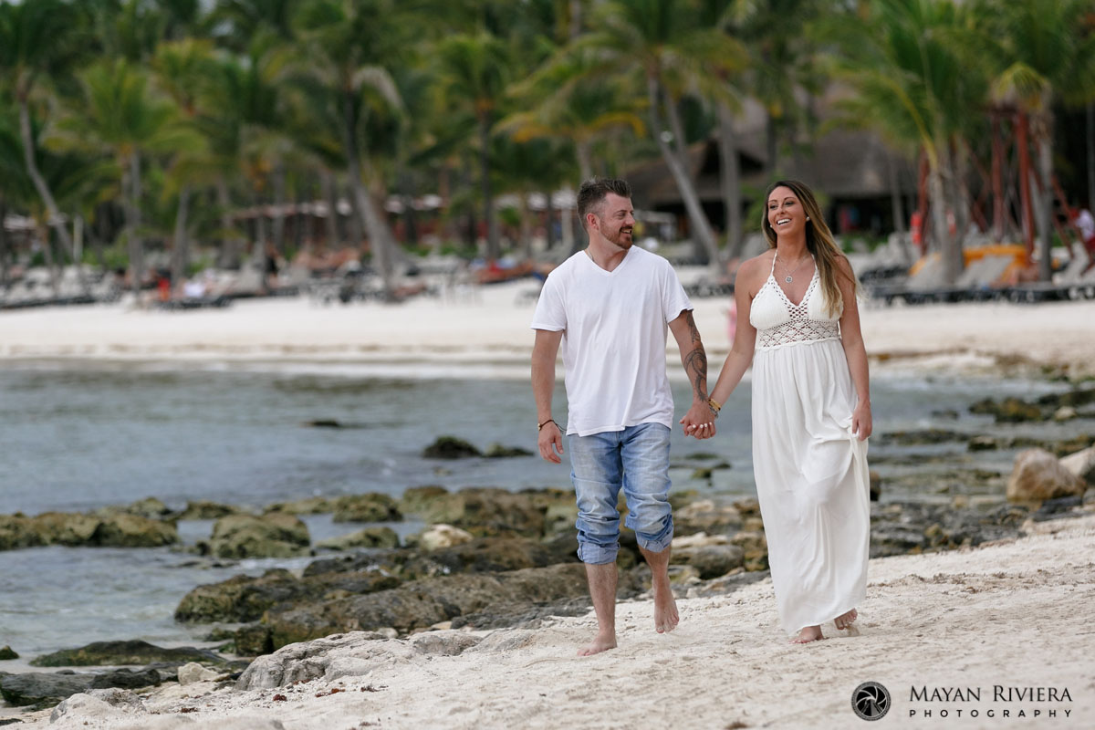 CoupleStrollsHandInHandOnBeach