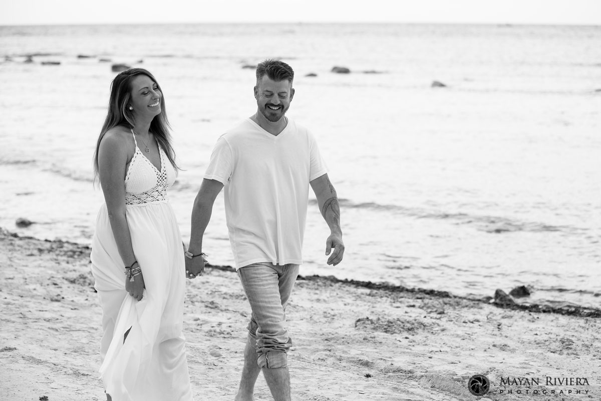 CoupleStrollsHandInHandOnBeach