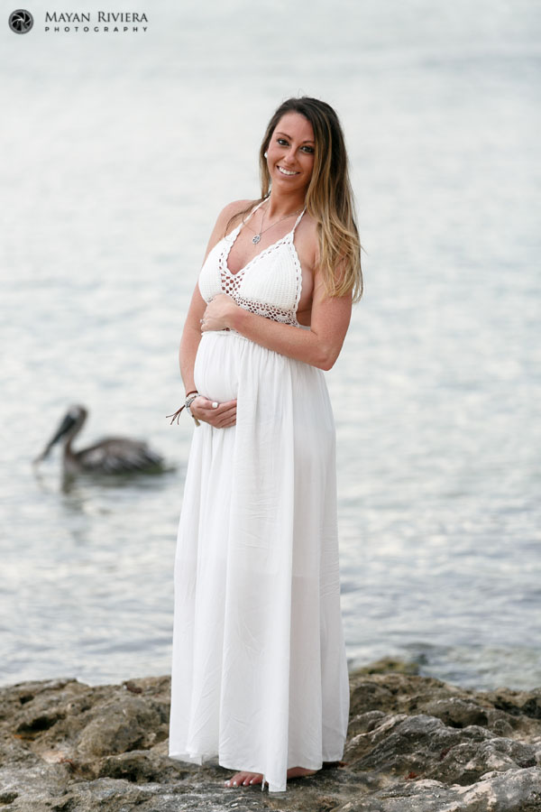 CaitlinCraddlesBabyBumpStandingOnRock