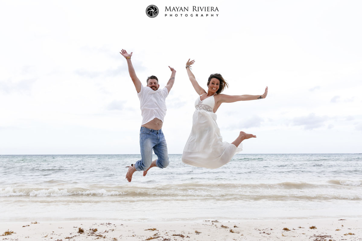 CoupleJumpsForJoyOnBeach