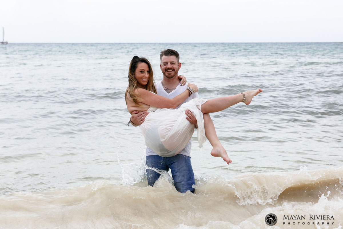 JasonHoldsCaitlinInHisArmsStandingInOcean