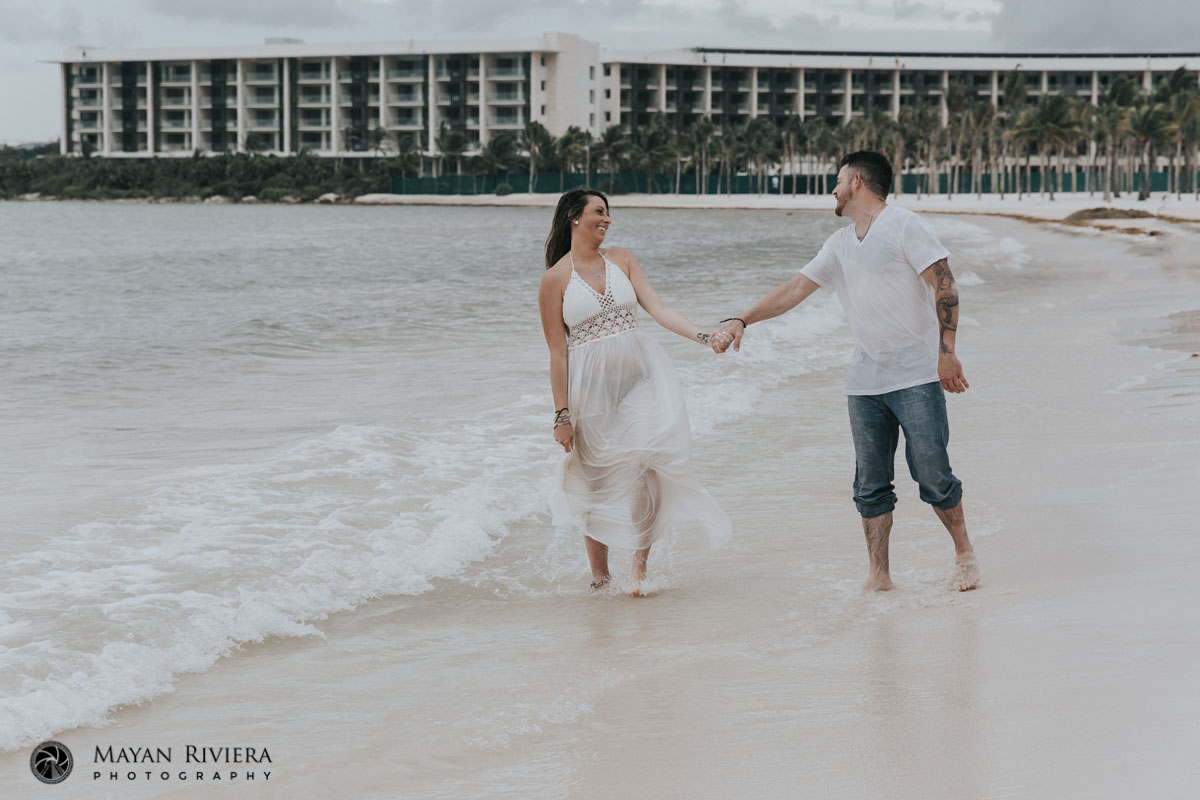 CoupleWalksHandInHandOnBeach