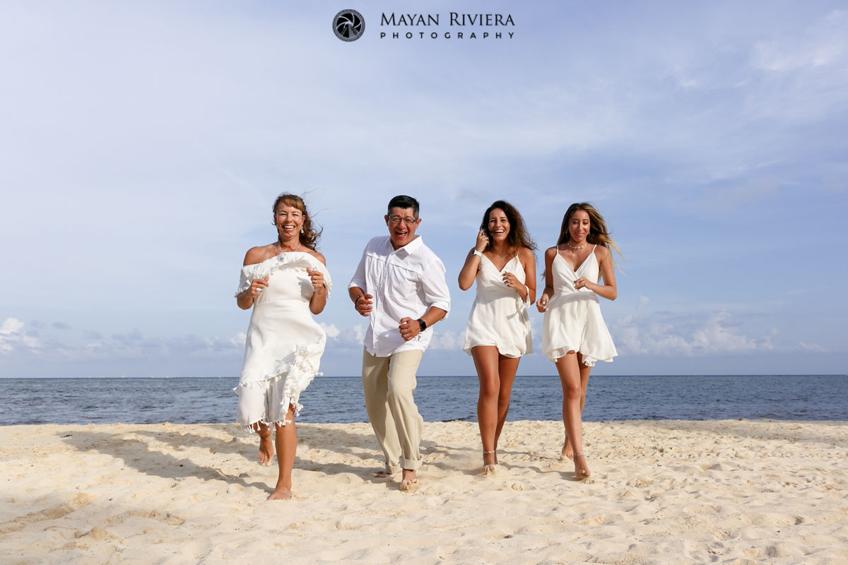 LaughingFamilyRunsOnBeach