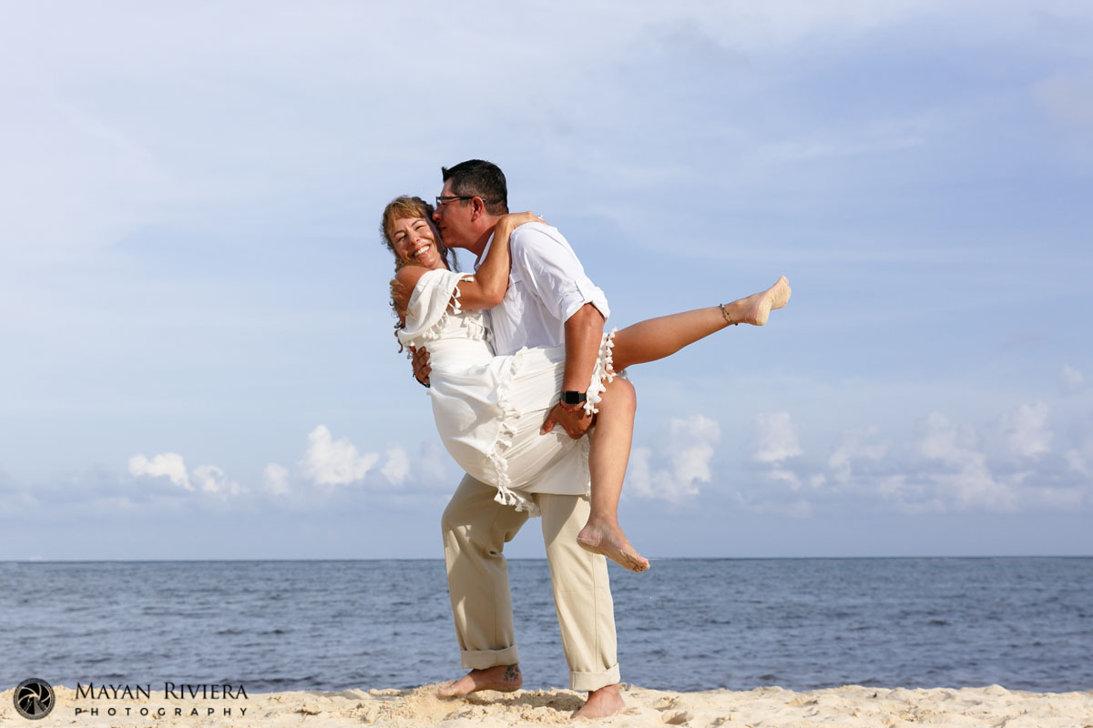 DadHoistsMomInHisArmsWithAKiss