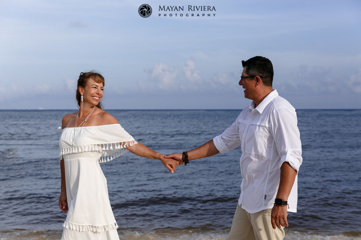 ParentsHoldHandsOnBeachwalk