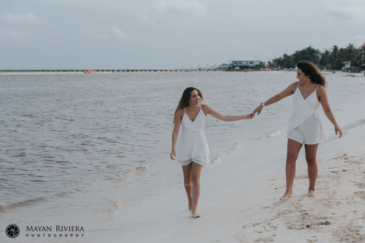 SistersHoldHandsOnBeachwalk