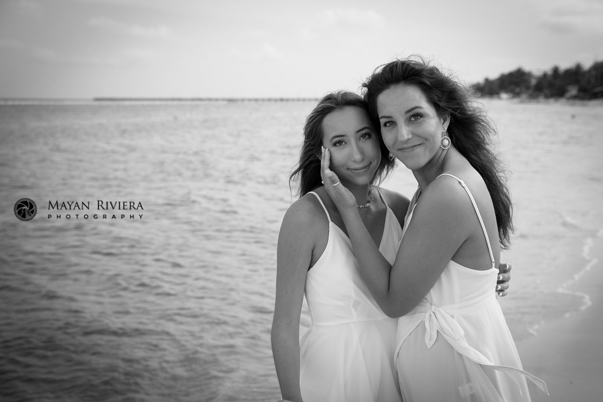 SmilingSistersPoseTogetherOnBeach