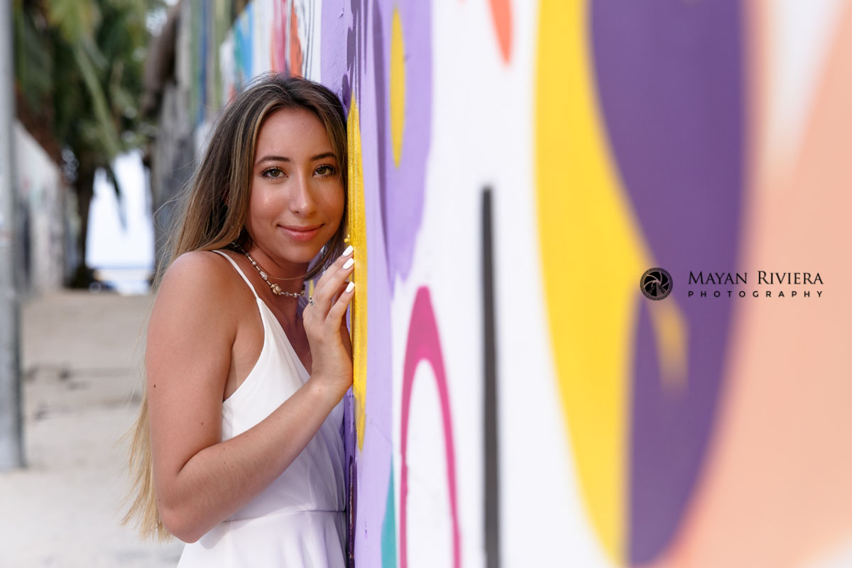 SisterPosesByGraffitiWall