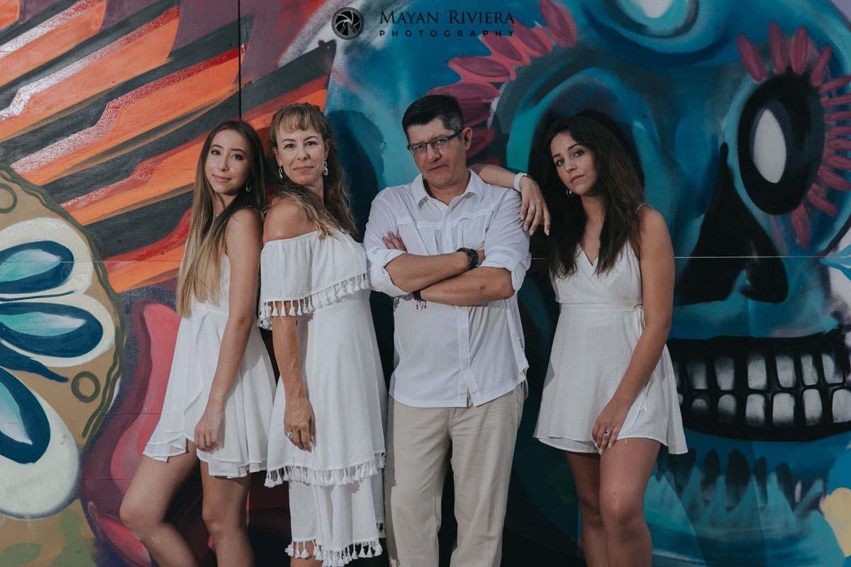 SeriousFamilyPosesByGraffitiWall