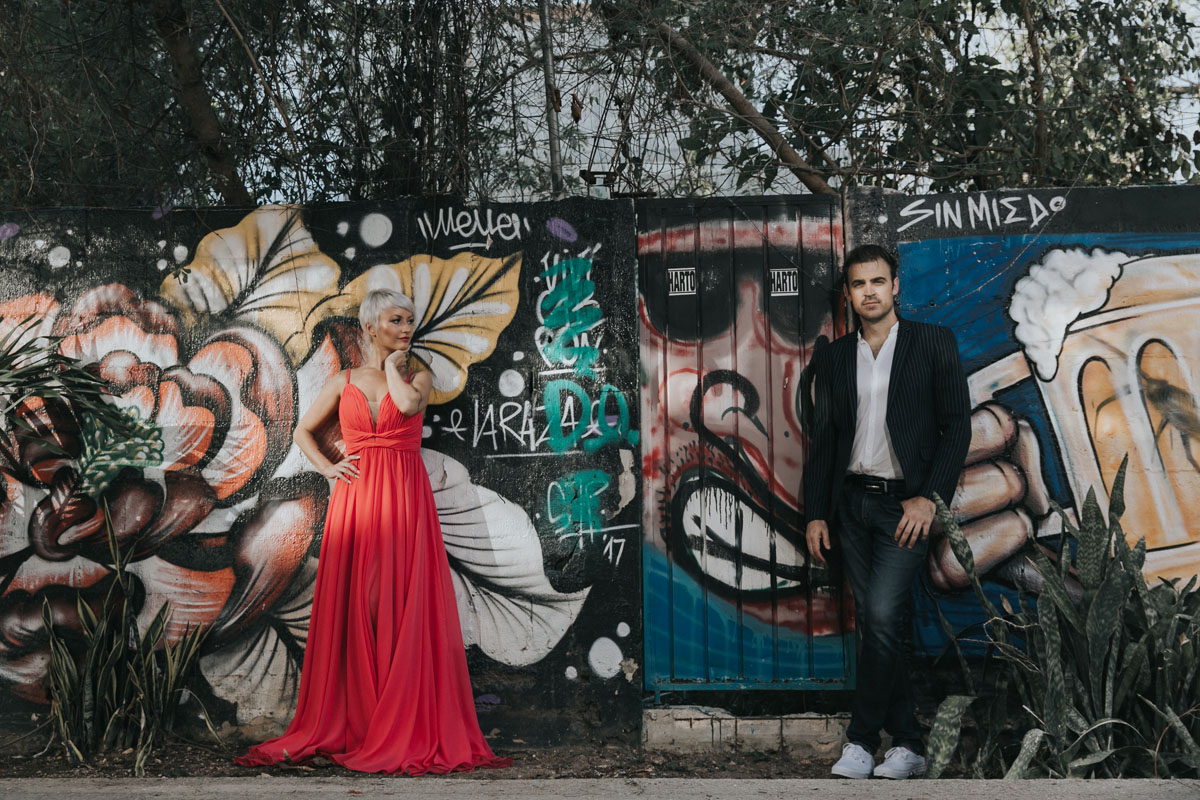 GitaAndAlanPoseByGraffitiWall