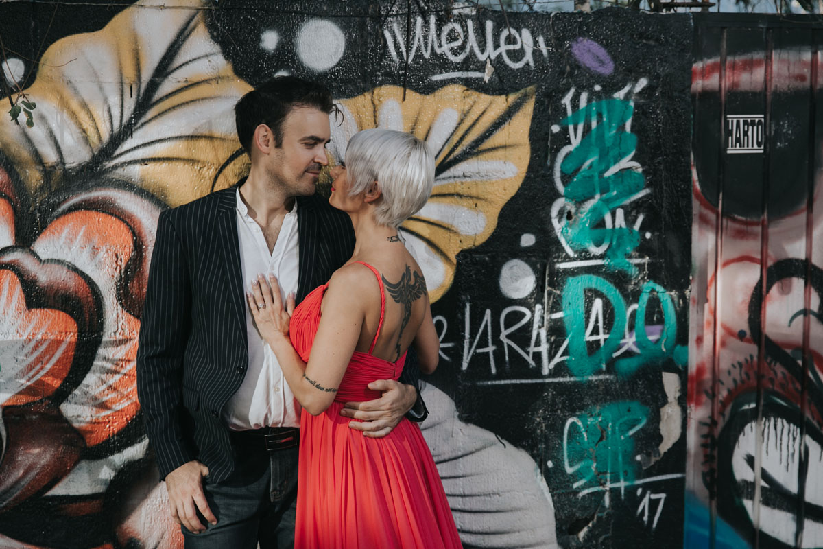 GitaAndAlanPoseByGraffitiWall