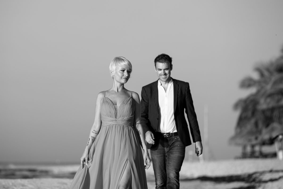 GitaAndAlanStrollBeachAtSunrise