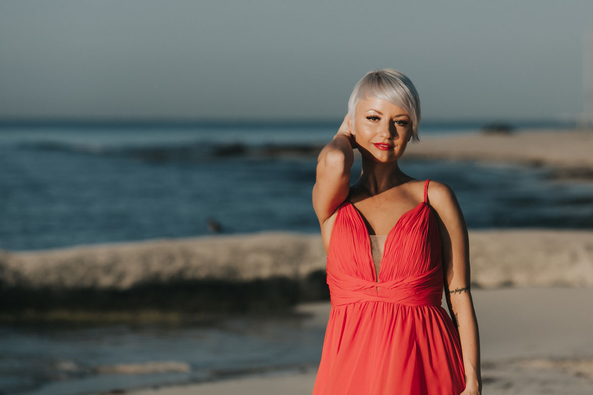 GitaPosesOnBeachtAtSunrise