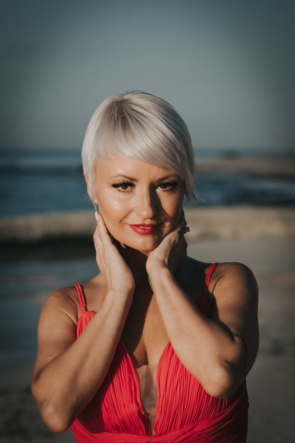 GitaPosesOnBeachtAtSunrise