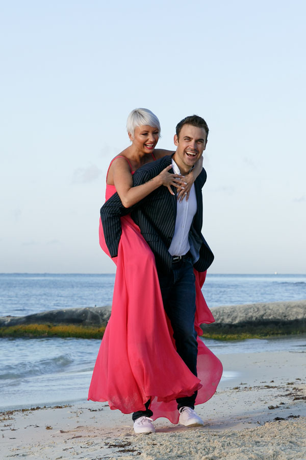 GitaJumpsOnAlansBackOnBeach