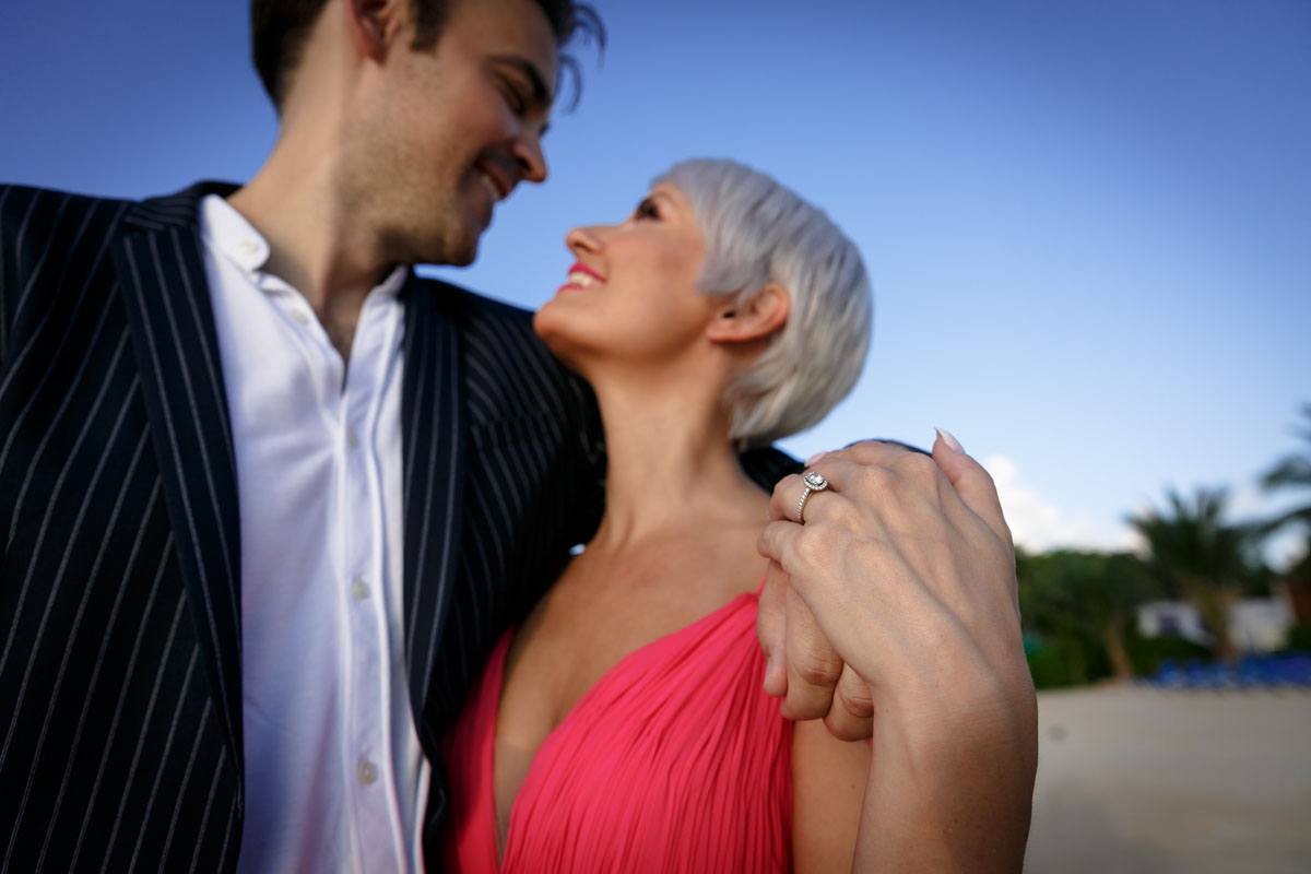 AlanHoldsGitaInHisArmsShowingRing