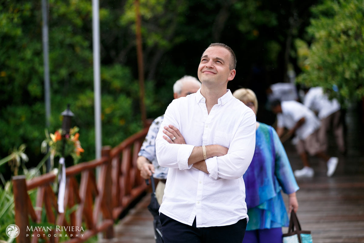 WeddingGuestLooksUpAtRainySky