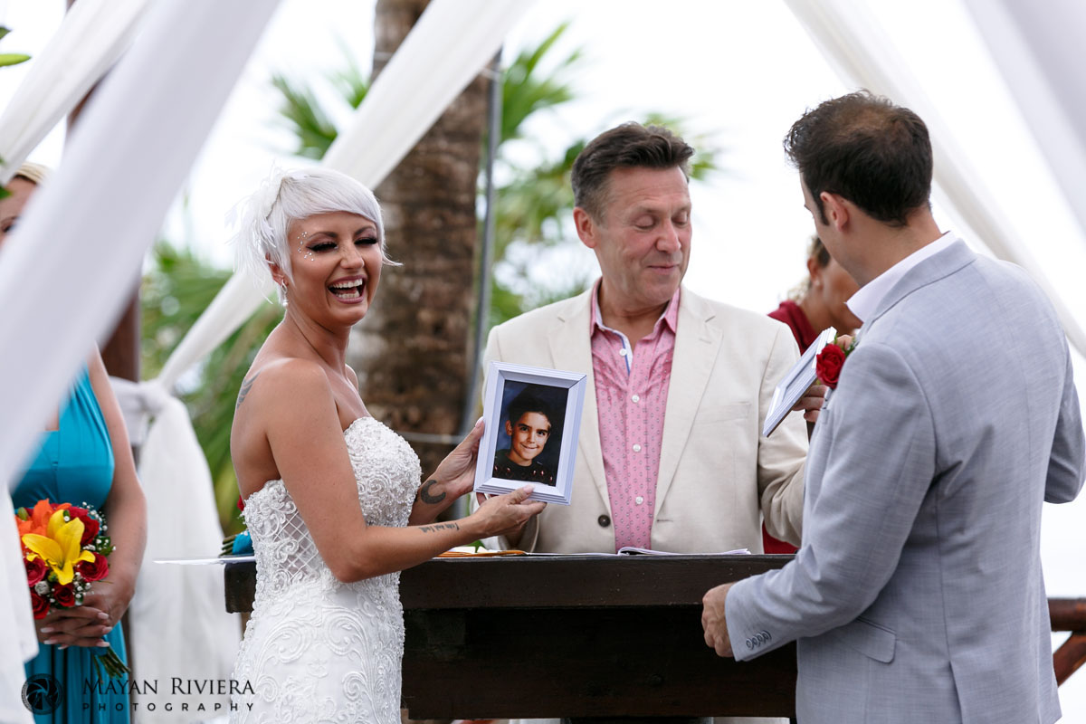 HoldingUpPortraitsAtCeremony