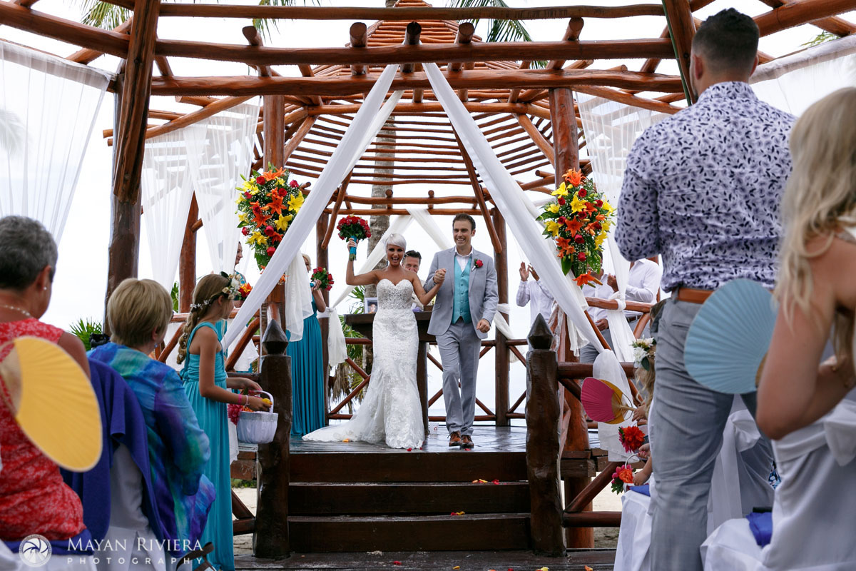 CheeringNewlywedsLeaveCeremony