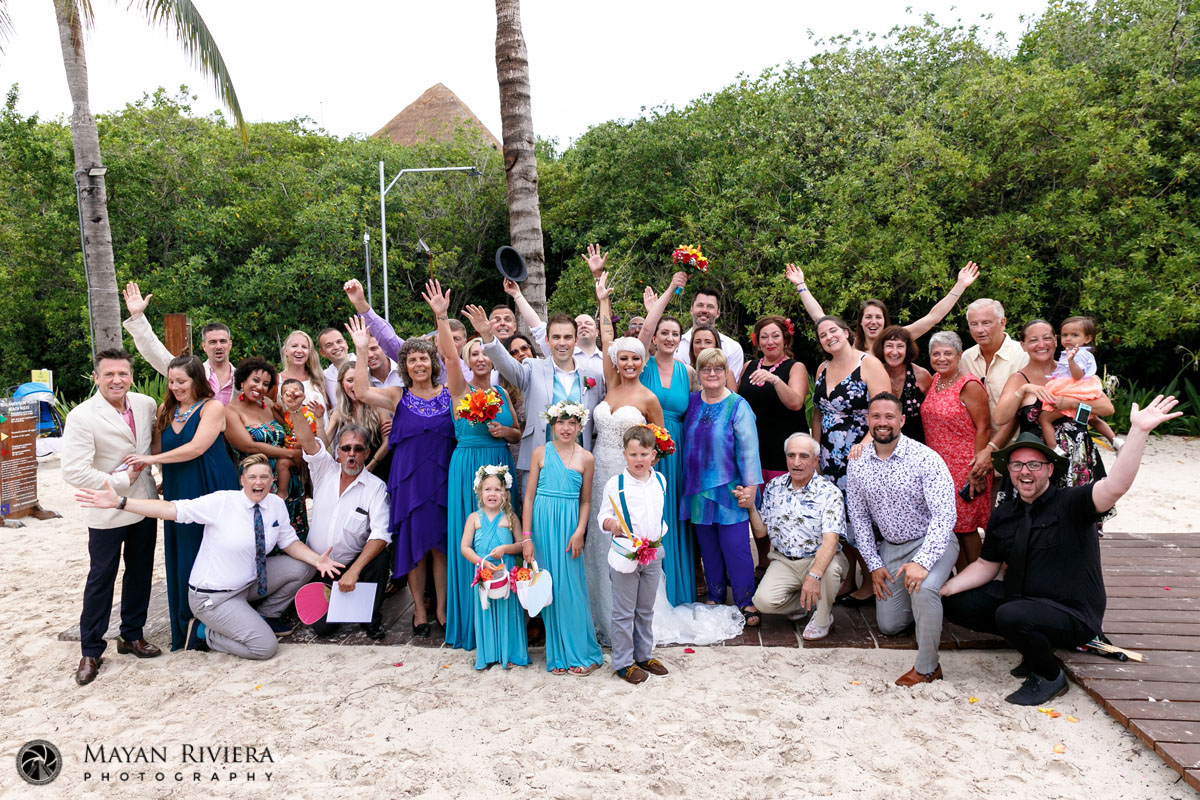 GuestsCheerNewlywedsRaisingArms