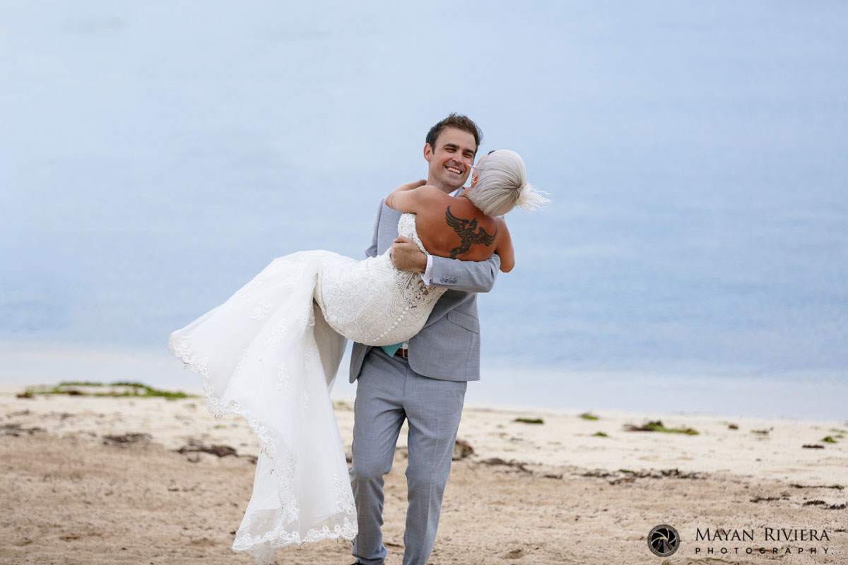 AlanCarriesGitaInHisArmsLaughingOnBeach