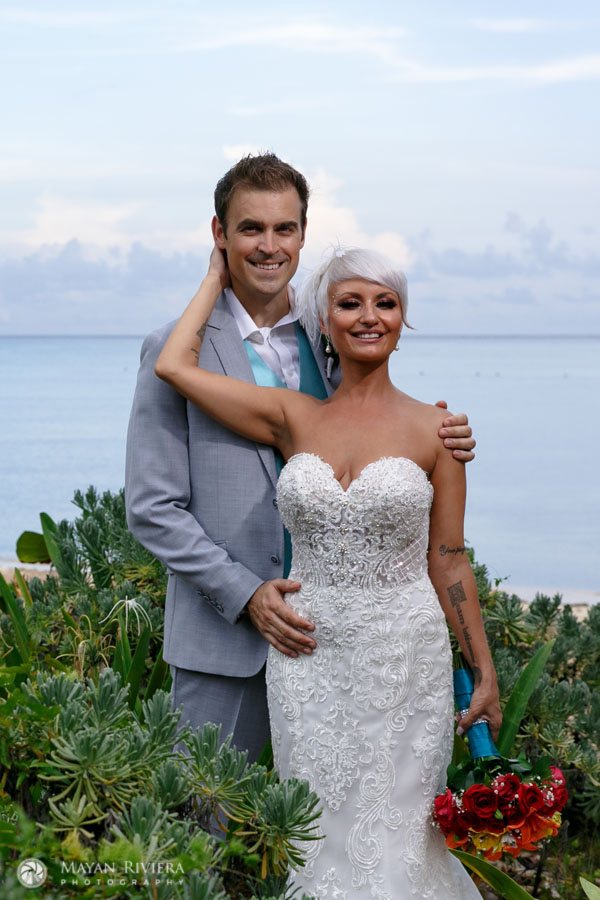 SmilingNewlywedsEmbraceEachOtherOnBeach