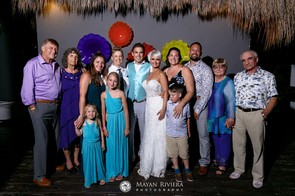 WeddingGuestsPoseWithNewlyweds