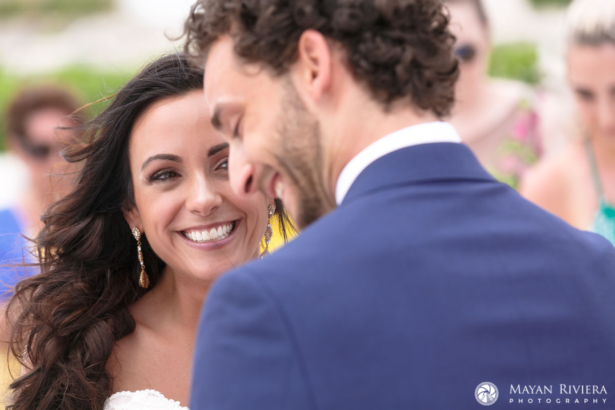 BrideSmilesAtSmilingGroom