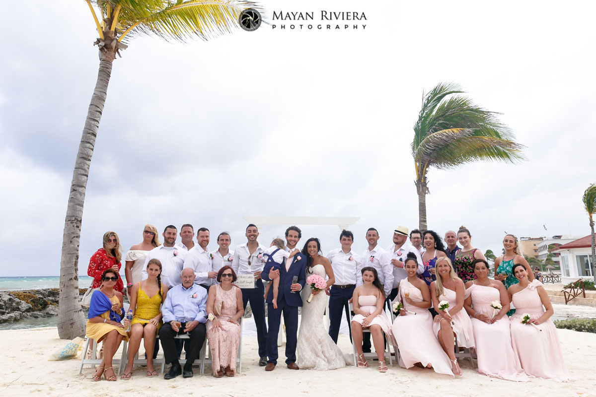 WeddingGuestsPoseWithNewlyweds