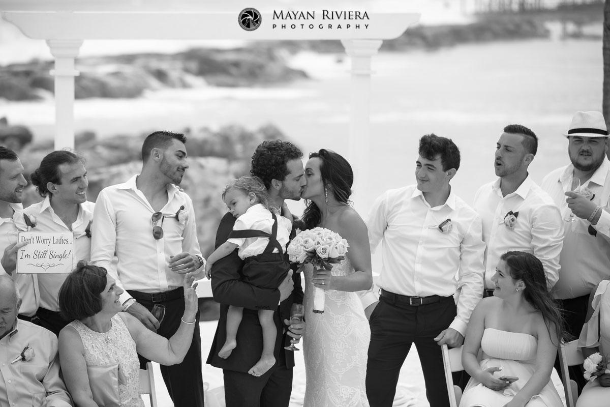 NewlywedsKissOnBeach