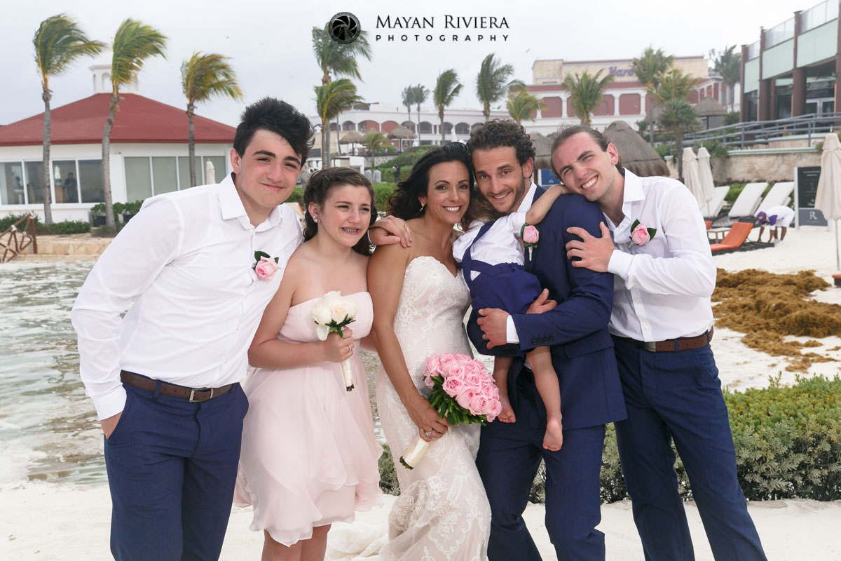 NewlywedsPoseWithKidsOnBeach